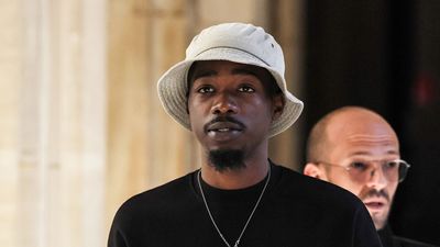 French rapper Mohamed Sylla, aka MHD, arrives for the opening of his and eight other men's trial over a murder committed during a brawl between two rival gangs in Paris in 2018, at the Palais de Justice courthouse in Paris, on September 4, 2023. The artist and four co-defendants will appear free, three others are still in pre-trial detention and the last, still at large, will be tried in absentia. They face thirty years' imprisonment.