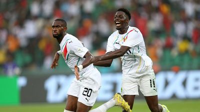 Guinean player Mohamed Bayo (R) is reacting after scoring a goal against Equatorial Guinea during the Round of 16 football match of the Africa Cup of Nations (CAN) 2024 between Guinea and Equatorial Guinea at the Olympic Stadium of Ebimpe in Ivory Coast, on January 28, 2024.