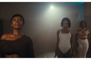 Gyakie and two dancers perform in the music video for “Sankofa”