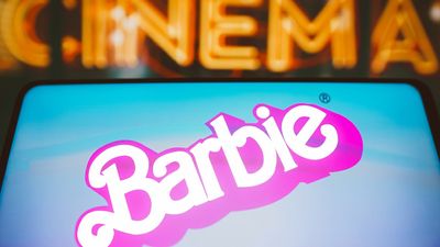 I​n this photo illustration, the Barbie the movie logo is seen displayed on a smartphone.