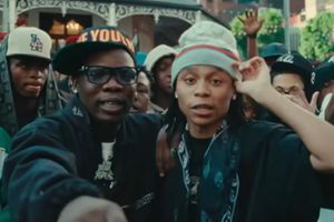 South African artists Jaykatana and Blxckie together in a crowd of young people. 