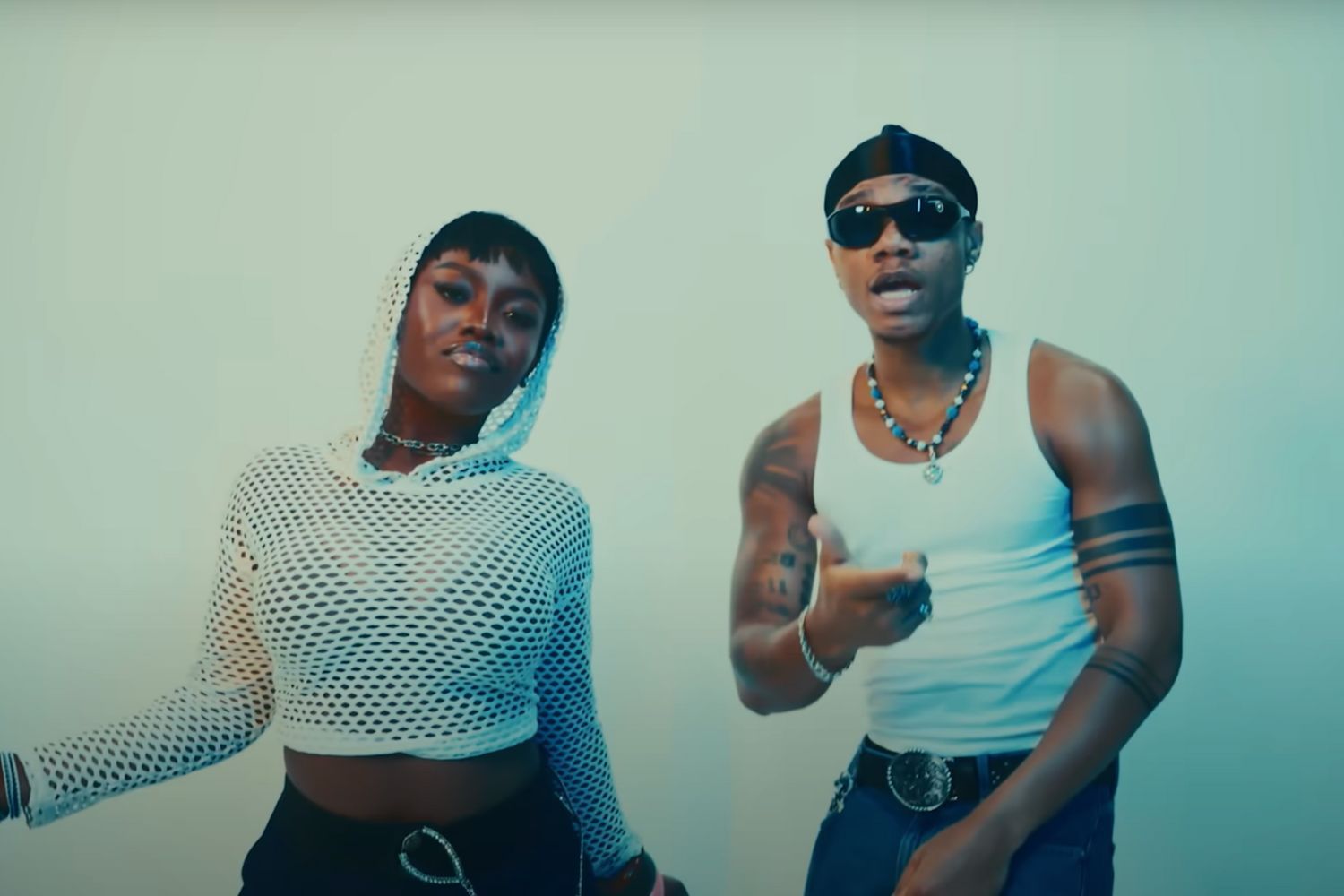 KiDi and Gyakie in the music video for “Cheat On You.”