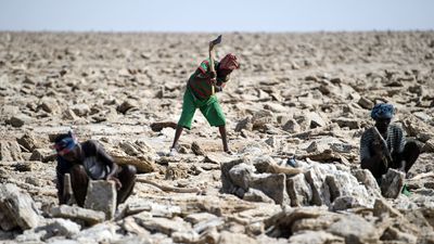 Miners digging out salt blocks by hand in the Danakil Depression on January 22, 2017 in Dallol, Ethiopia. 