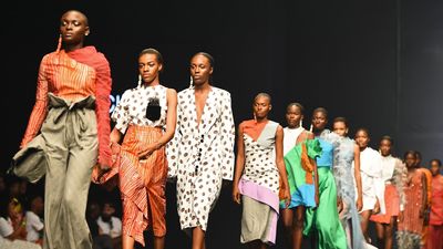 Models present creations by Fruche during the Lagos Fashion Week on October 25, 2018. 