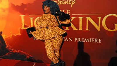 Moonchild Sanelly poses in leopard print top and pants at the South African premiere of 'The Lion King'. 