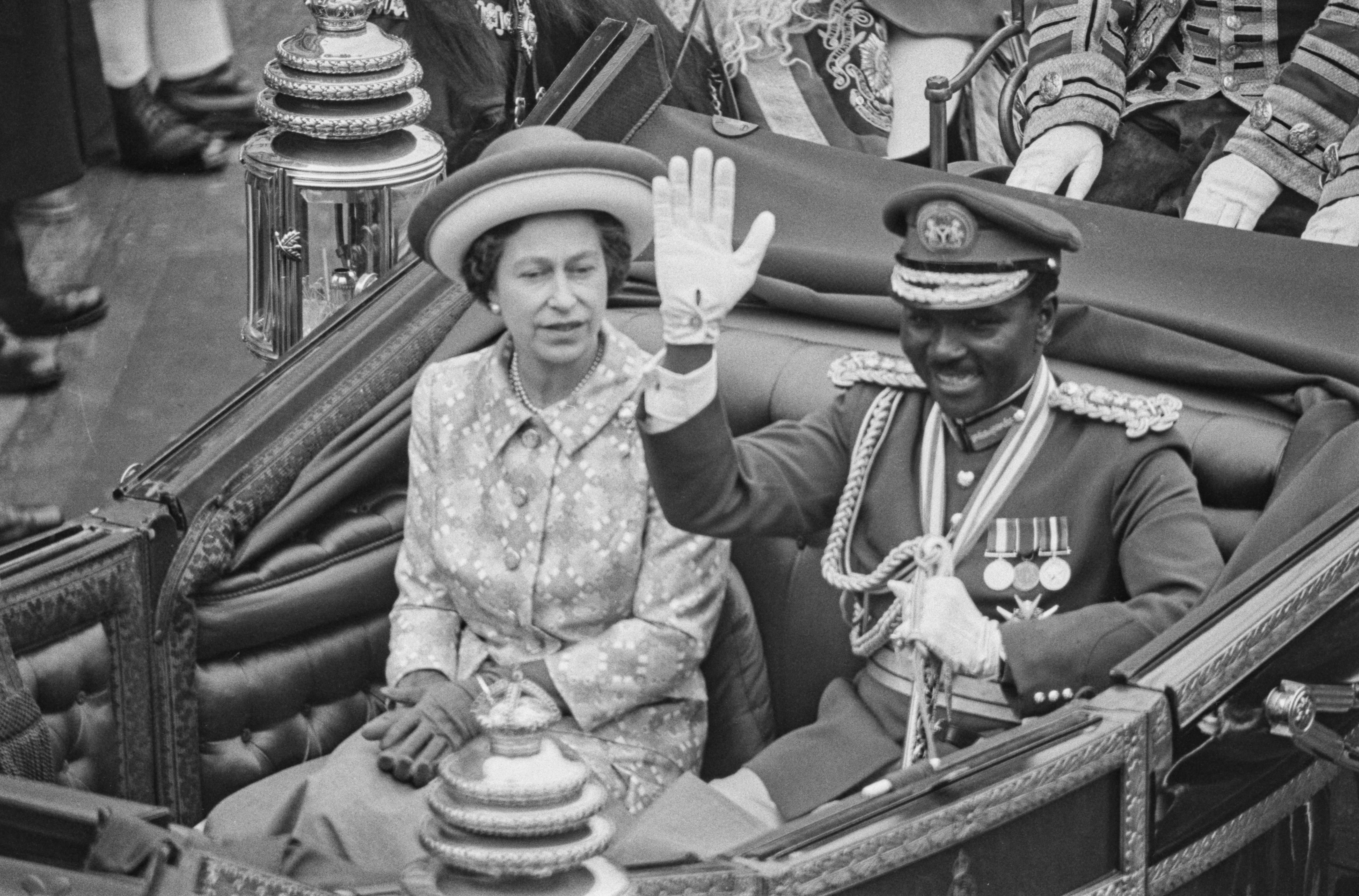 An image of Nigerian Head of State Yakubu Gowon riding with Queen Elizabeth II in a chariot in London, UK, June 1973.