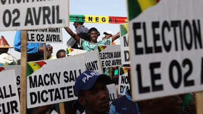 People, holding banners, gather to stage demonstration demanding early presidential elections in Dakar, Senegal on March 02, 2024.