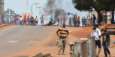 ​Protesters in Guinea clash with protesters over COVID-19 measures.