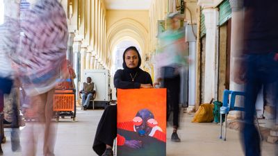 Reem Aljeally with her painting 