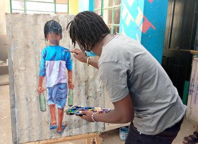 A man paints a picture of a child holding two empty bottles