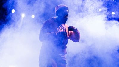 South African rapper Sjava on stage in a puff of smoke. 