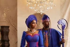 Juma Jux and Priscilla Ojo stand together in elegant royal blue traditional attire from Jux’s new song “God Design.”