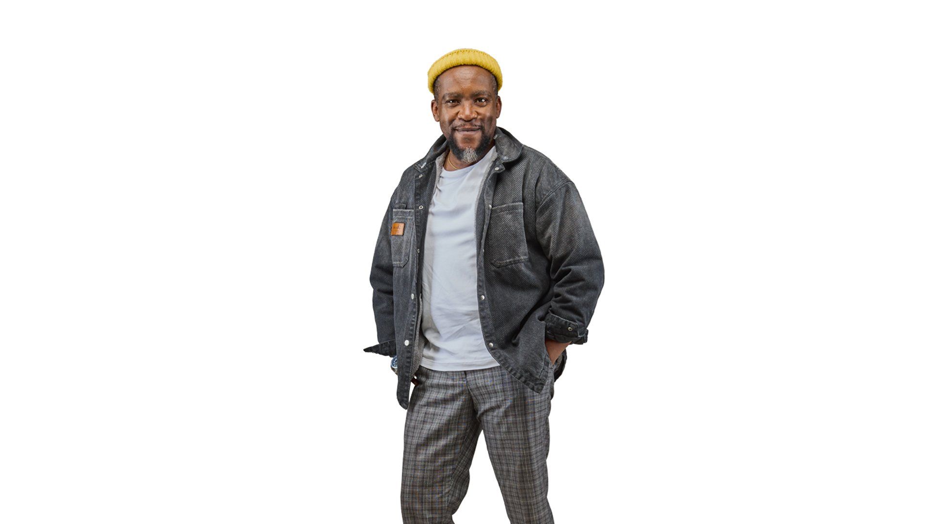 A photo of actor Jimmy Gathu smiling confidently at the camera.