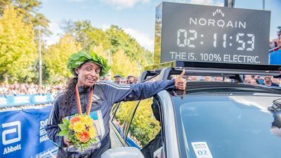 Tigist Assefa from Ethiopia celebrates the win with the new world record of 2 hours, 11 minutes and 53 seconds during the 2023 BMW Berlin-Marathon on September 24, 2023 in Berlin, Germany. 