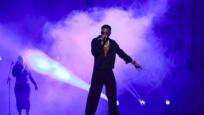 Nigerian superstar Wizkid performing at a festival.