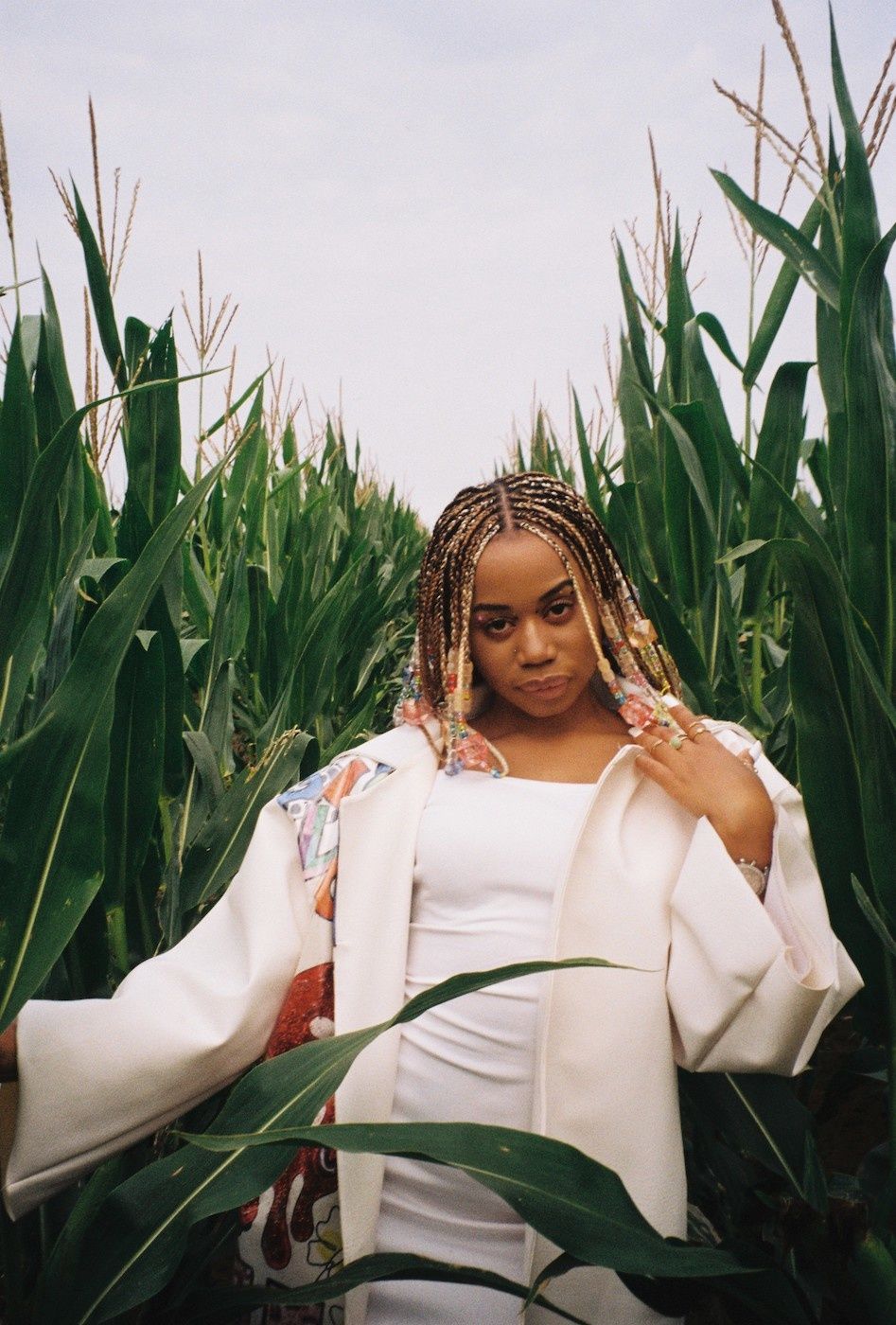 A portrait of Sha Sha in a maize/corn field. 