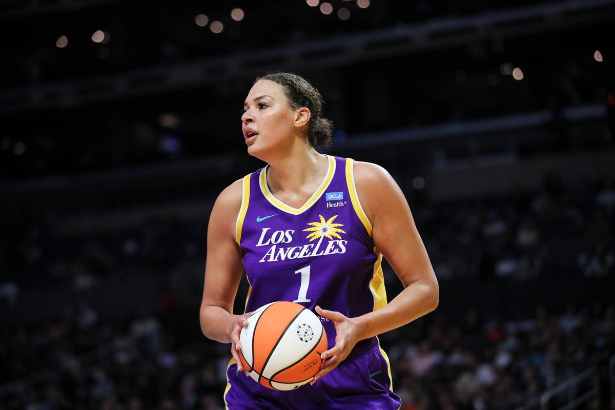Liz Cambage #1 of the Los Angeles Sparks handles the ball in the first half against the Seattle Storm at Crypto.com Arena on July 07, 2022 in Los Angeles, California.