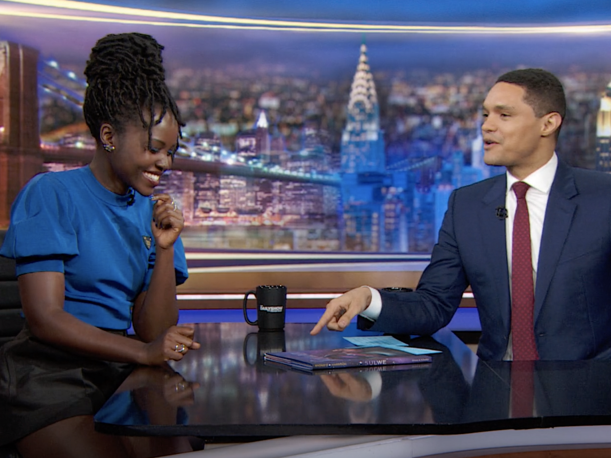  Lupita Nyong'o blue dress and Trevor Noah with suit