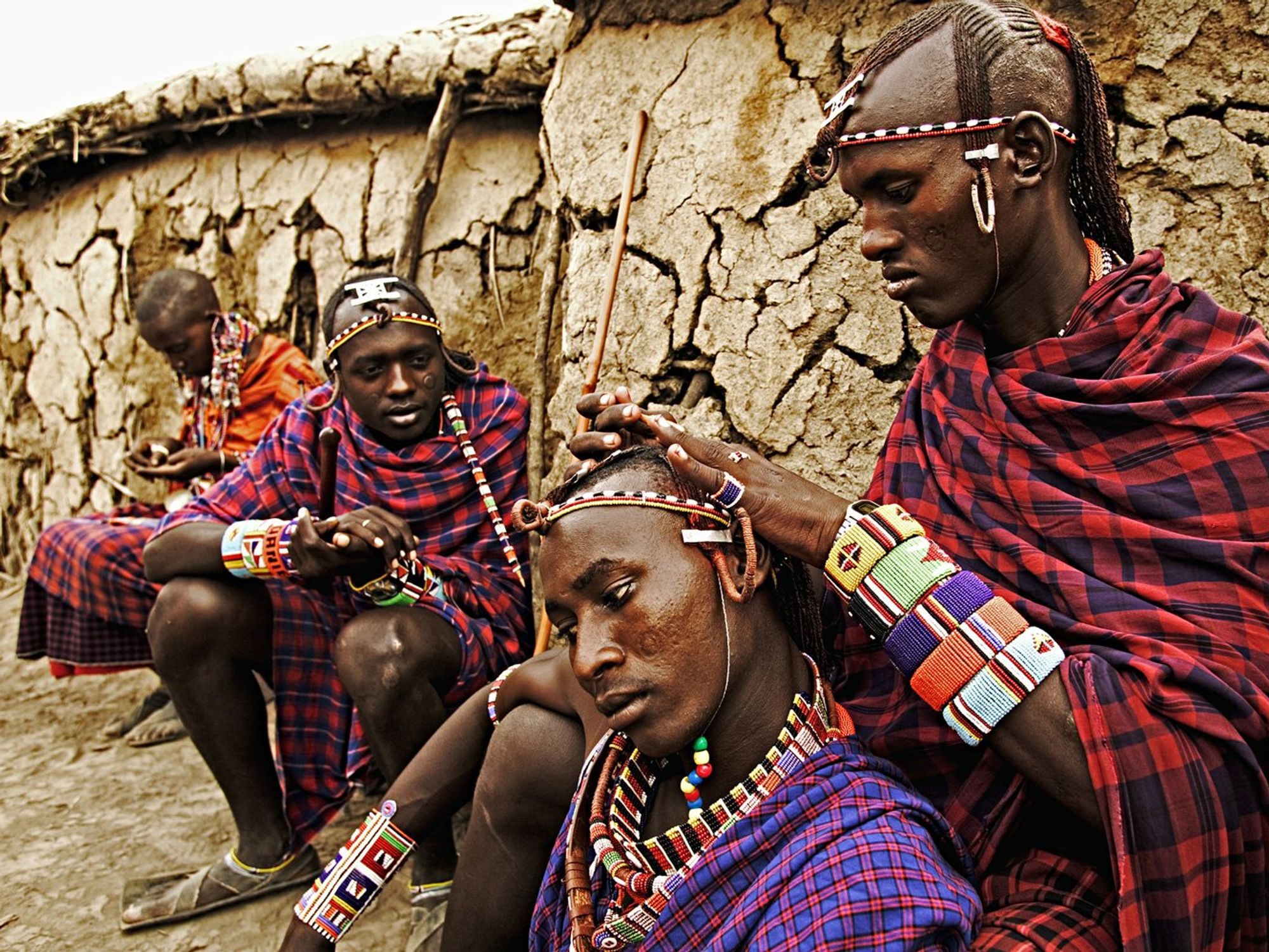 Maasai people. Men spend hours braiding each othersí long ochred colored hair. Near Amboseli National Park, Kenya