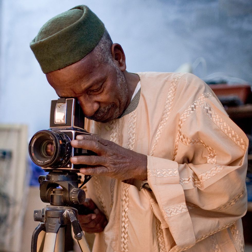 Malick Sidibé with his camera