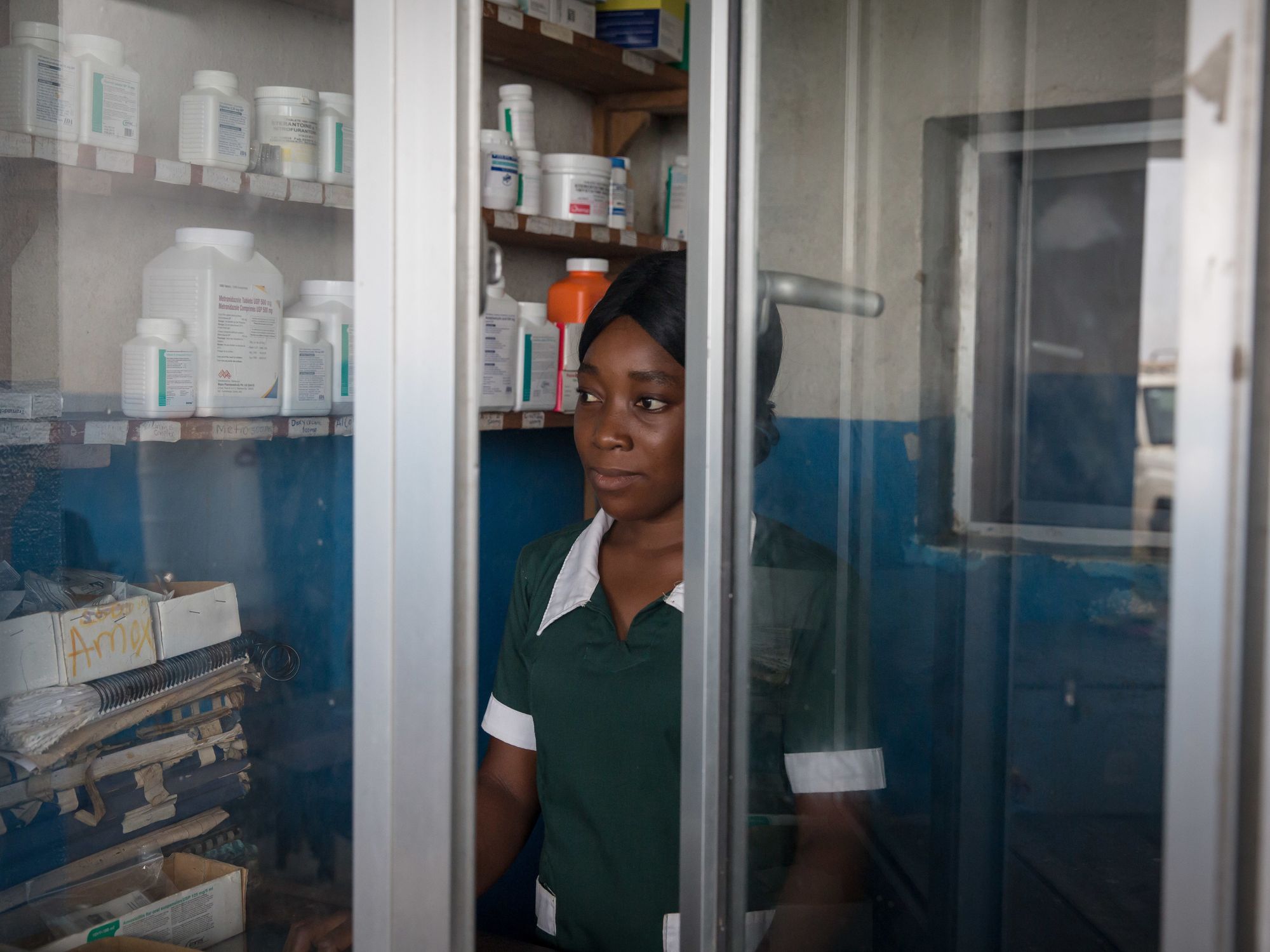 MARYLAND, LIBERIA - 2018/06/01: A medical worker seen standing in the pharmacy section of Pleebo Health Center, Maryland, southeast Liberia. Liberia is listed as one of the high-burden countries for tuberculosis by the World Health Organization. In September, the United Nations will hold the first-ever meeting on ending TB.