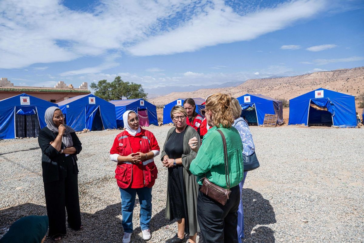 Minister for Development Cooperation and Metropolitan Policy Caroline Gennez speaks to aid workers during a visit to a shelter by the Hilal Ahmar humanitarian orgaziation in Ida Ou Gommad for victims of the earthquake, during a working visit of the Belgian Development Minister to Morocco, Sunday 15 October 2023.