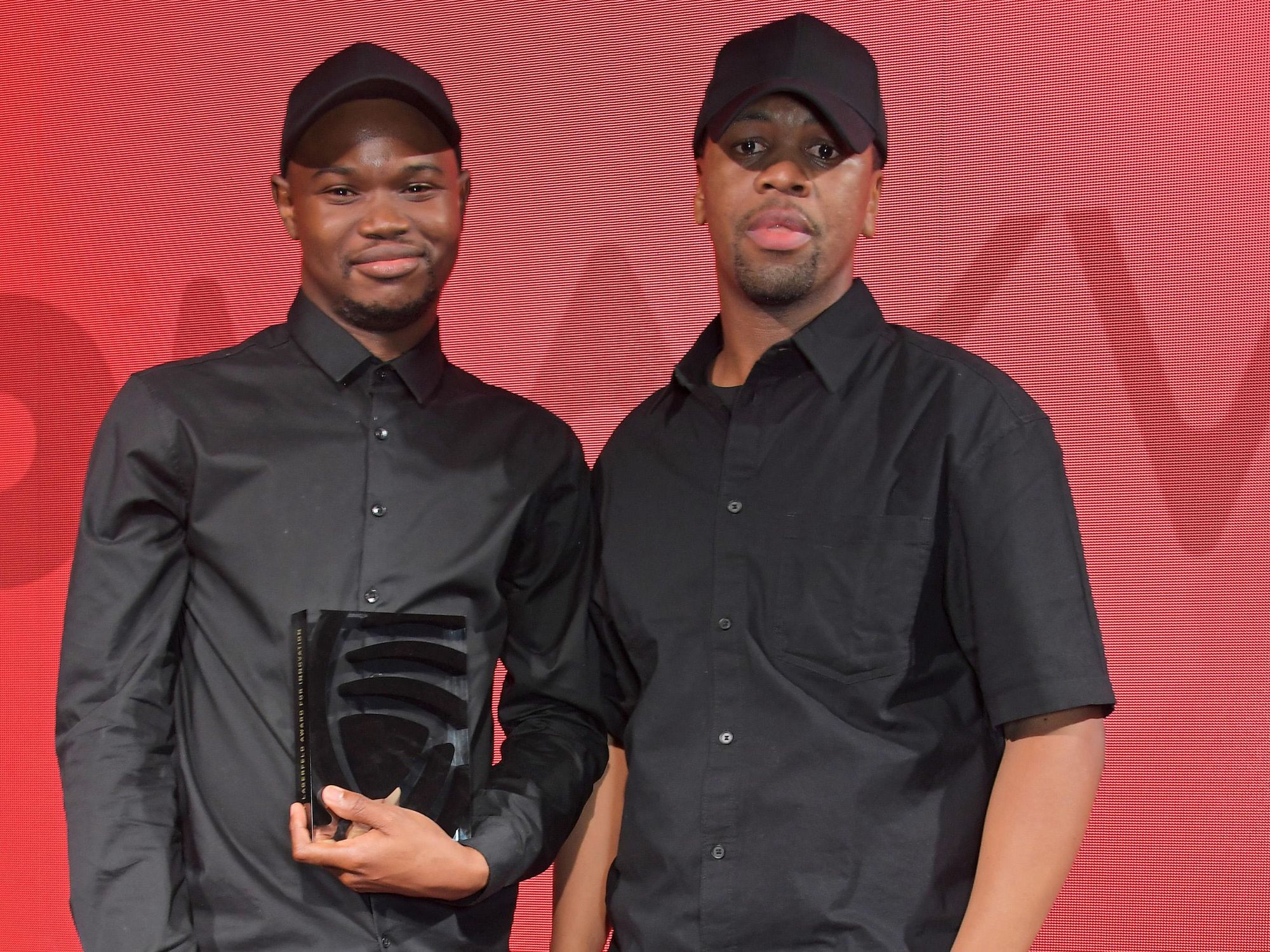 Mmuso Potsane and Maxwell Boko of Mmuso Maxwell wearing all black