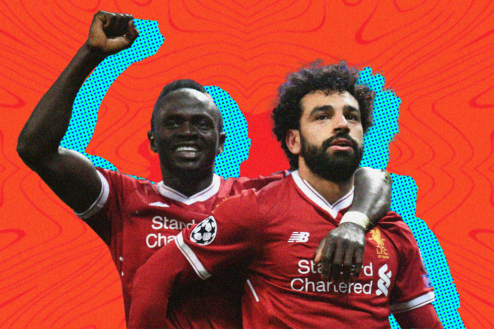 Mo Salah of Liverpool celebrates with teammate Sadio Manu00e9 after scoring a goal for Liverpoool.