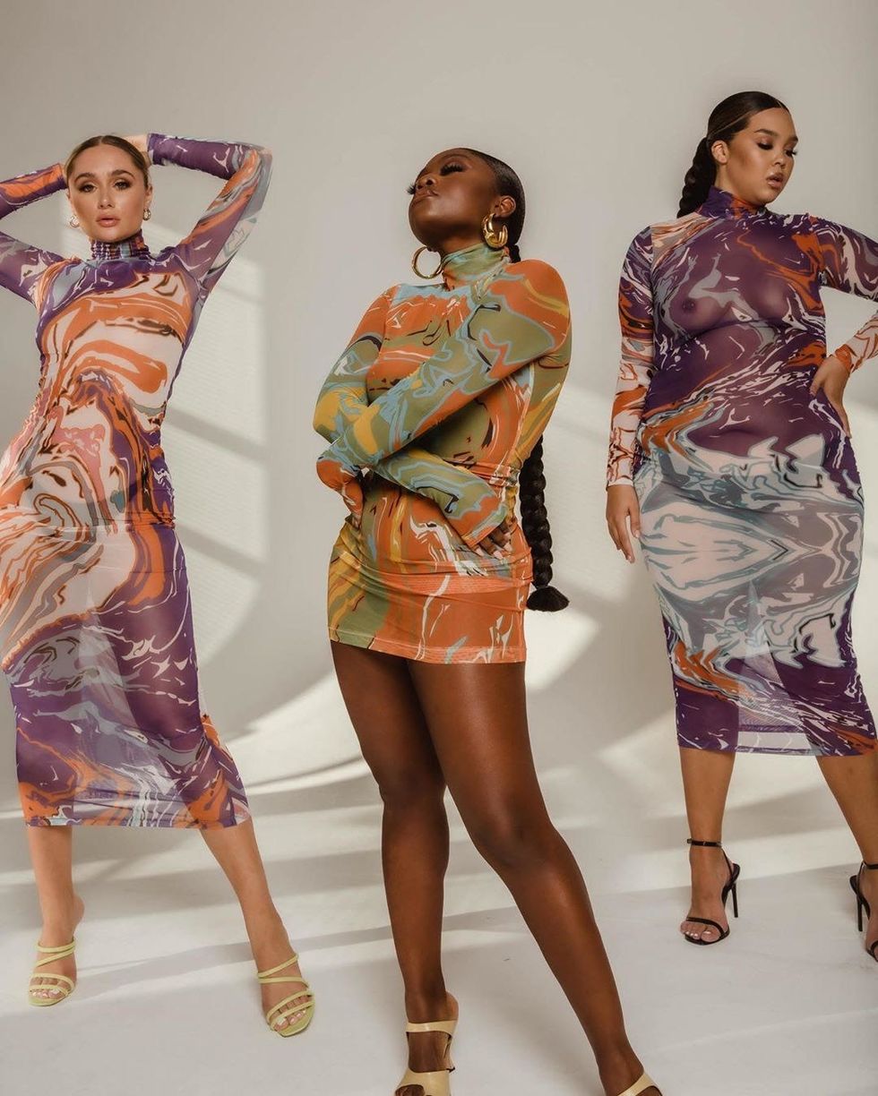 Models wearing Gaia dress in purple and orange, green and orange