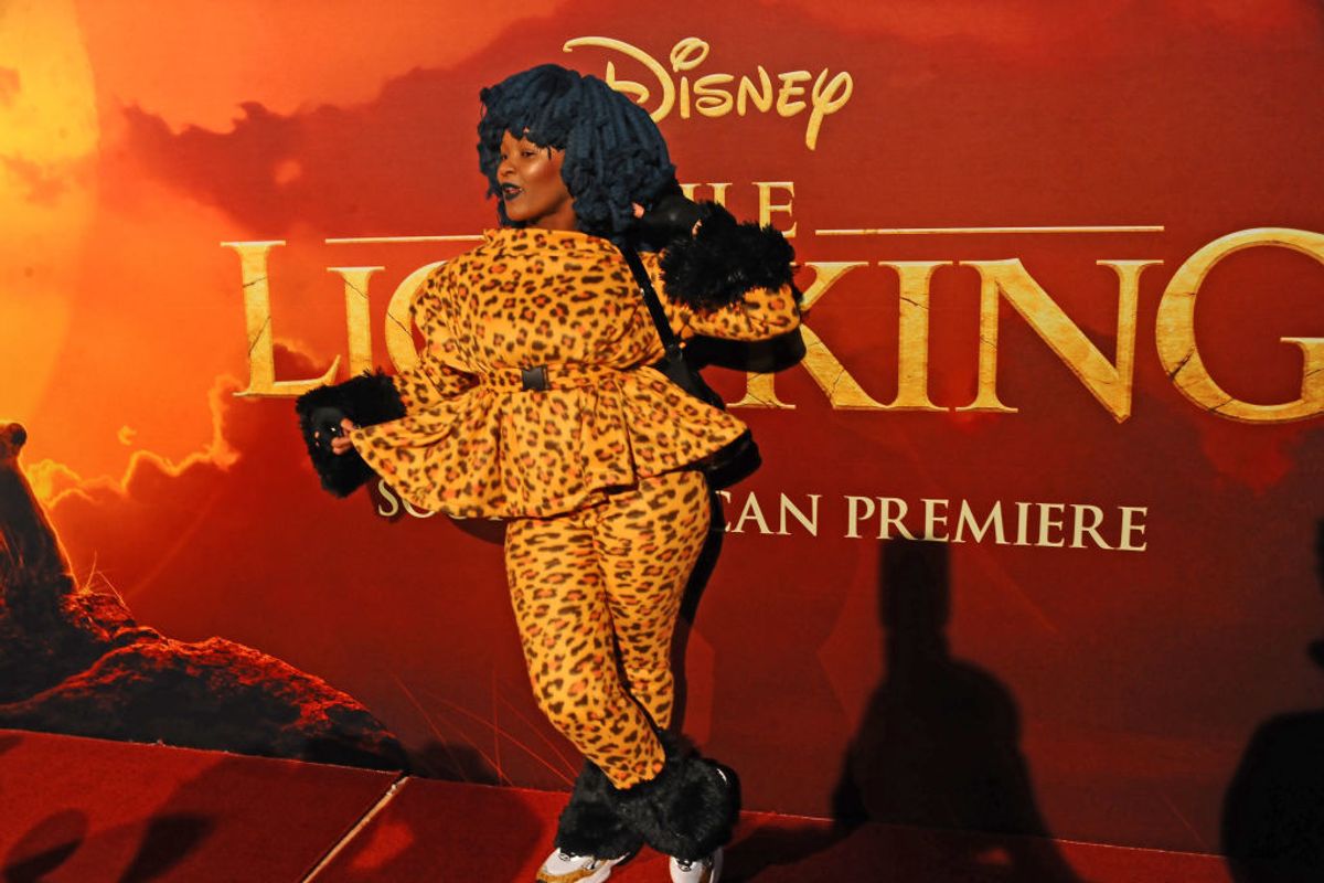Moonchild Sanelly poses in leopard print top and pants at the South African premiere of 'The Lion King'. 