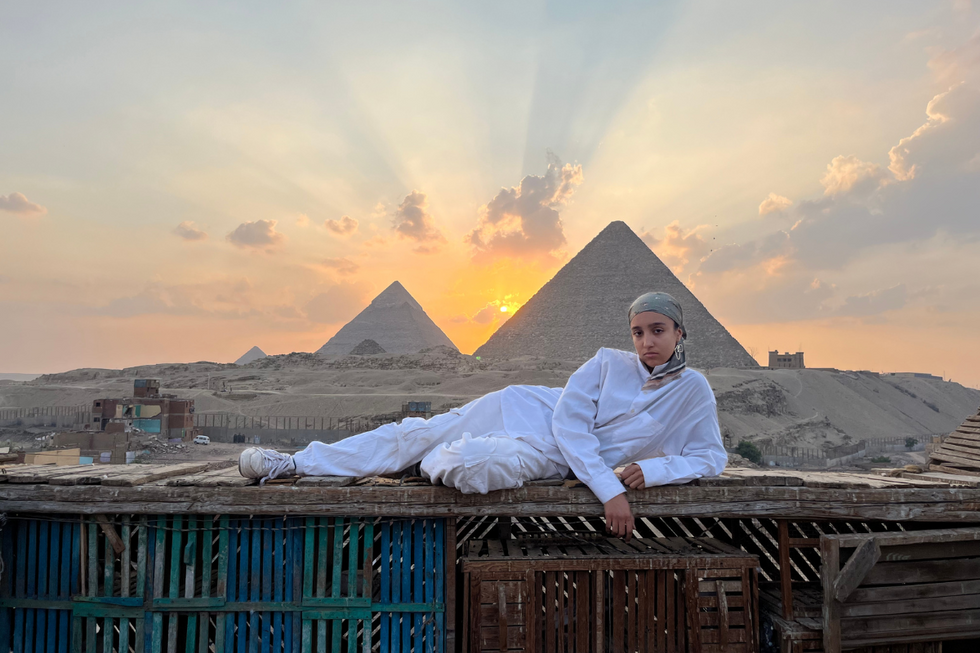 Moroccan photographer Zineb Koutten in front of the Pyramids of Giza.