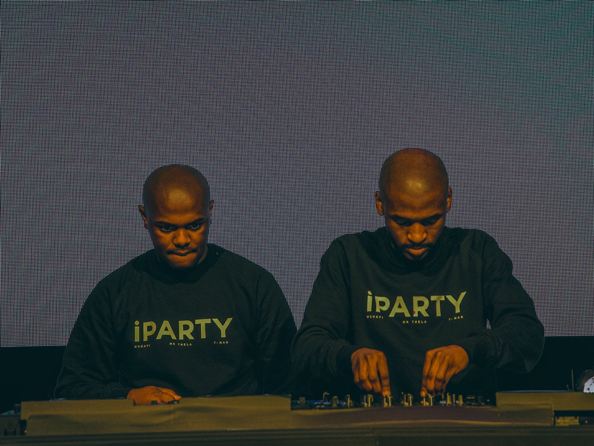 ​Mshayi & Mr Thela on the decks wearing matching sweaters written "IPARTY". 