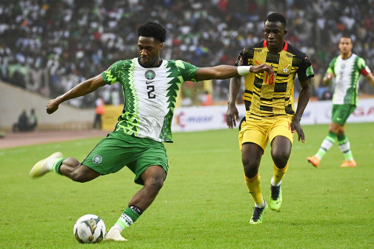 Nigeria's Ola Aina kicks the ball as Ghana's Felix Afena-Gyan looks on during the World Cup 2022 qualifying football match between Nigeria and Ghana at the National Stadium in Abuja on March 29, 2022. 