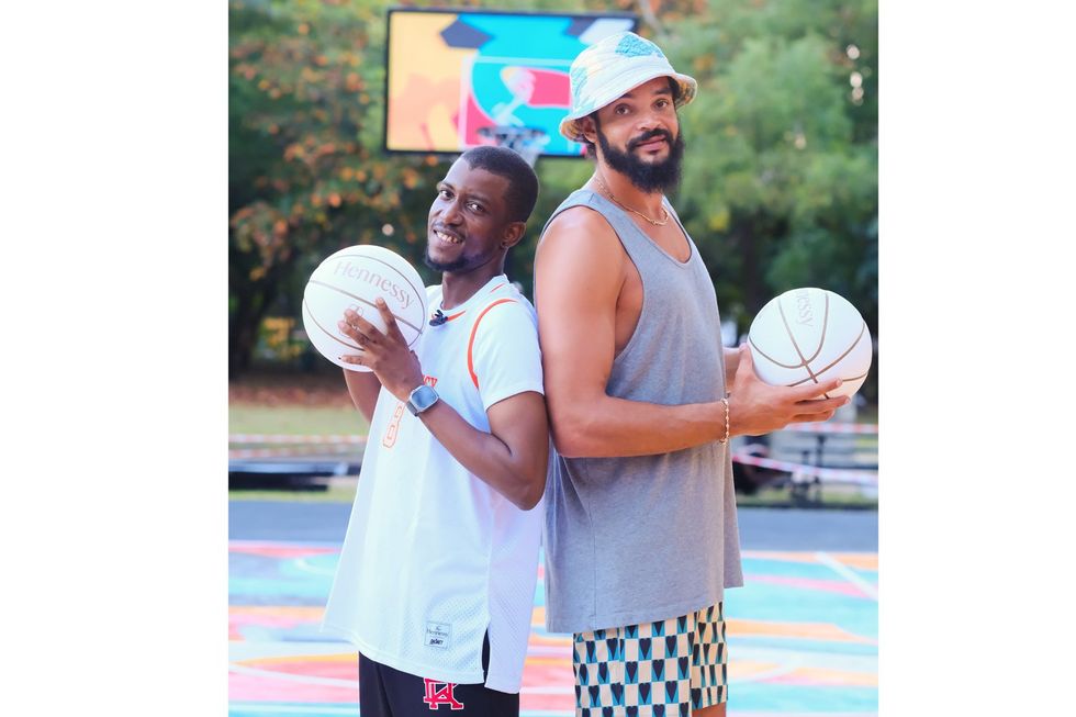 Nigerian artist Osa Seven and Joakim Noah posing together during the Hennessy 'In the Paint' court unveiing