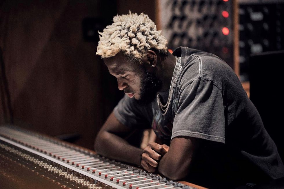 Nigerian producer Kel-p sits down at his studio board.