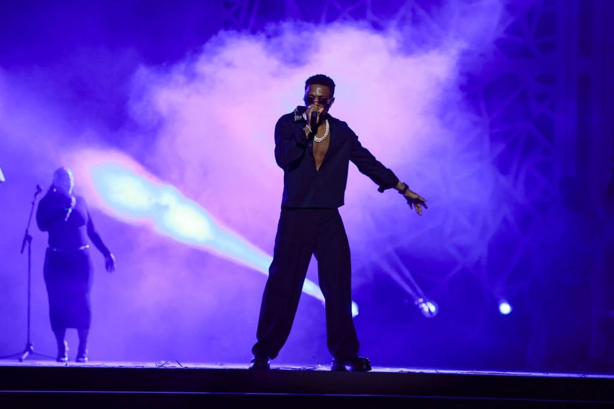 Nigerian superstar Wizkid performing at a festival.