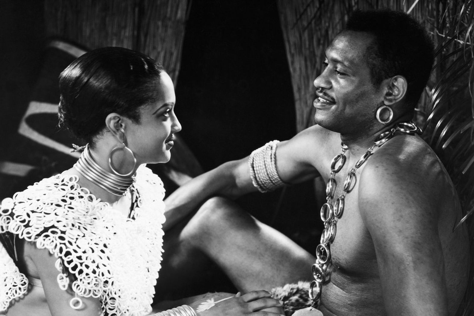 Nina Mae McKinney as Lilongo and Paul Robeson as Bosambo, both in the movie Sanders of the River. The film is directed by Zoltan Korda.