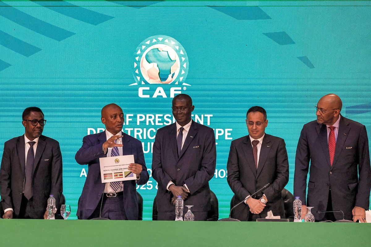 Patrice Motsepe (2nd-L), president of the Confederation of African Football (CAF), announces the host countries for the 2027 Africa Cup of Nations during a ceremony held in Cairo on September 27, 2023. The 2027 Africa Cup of Nations will be jointly hosted by Kenya, Uganda and Tanzania, while Morocco will host the 2025 edition, the Confederation of African Football announced.