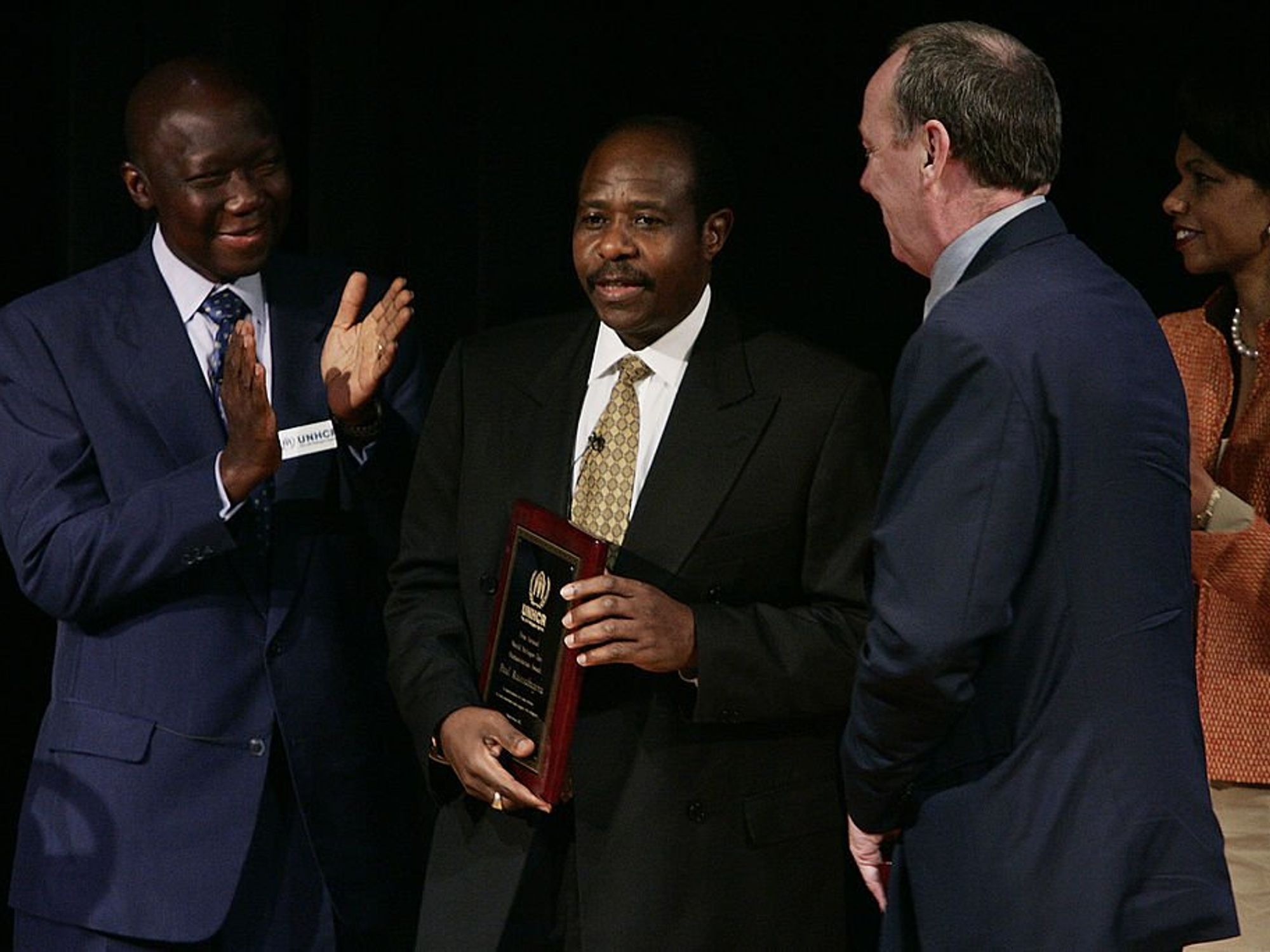 Paul Rusesabagina (2nd L), the real-life hero of movie "Hotel Rwanda," and the movie's director Terry George (3rd L) are presented with the first annual World Refugee Day Humanitarian Award by United Nations High Commissioner for Refugees' (UNHCR).