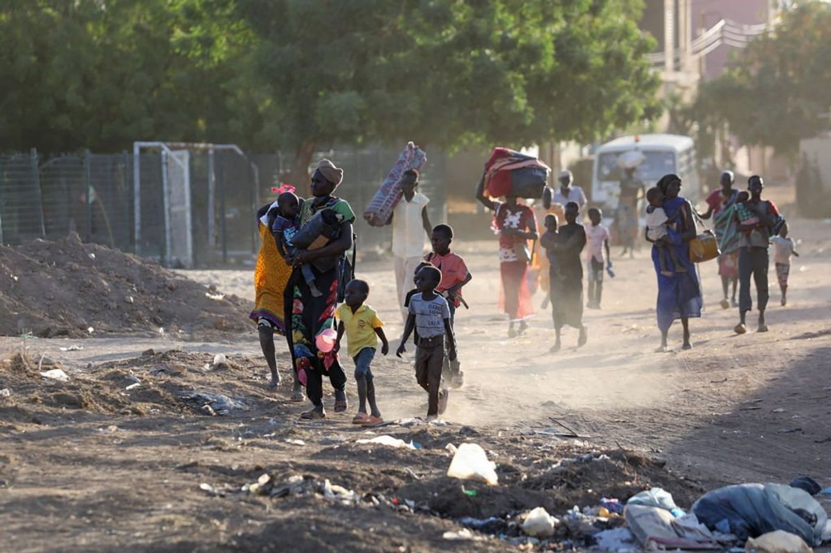 People flee their neighborhoods amid fighting between the army and paramilitaries in Khartoum