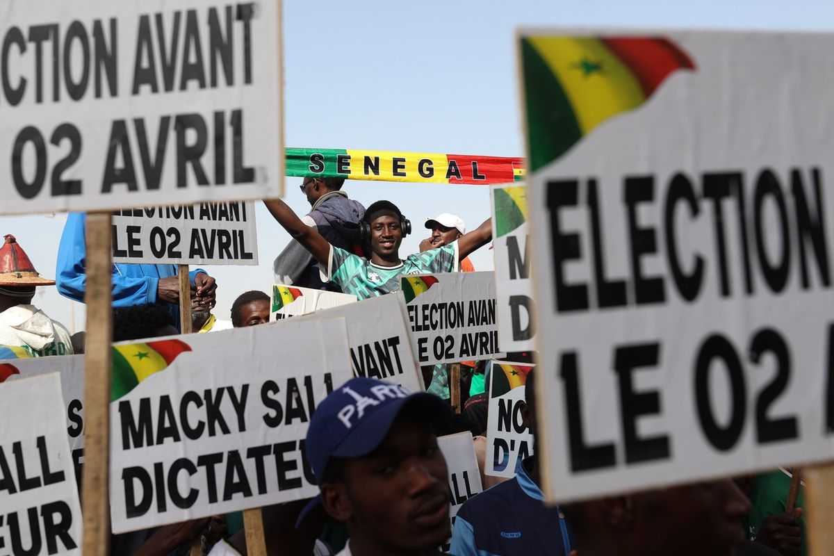 People, holding banners, gather to stage demonstration demanding early presidential elections in Dakar, Senegal on March 02, 2024.