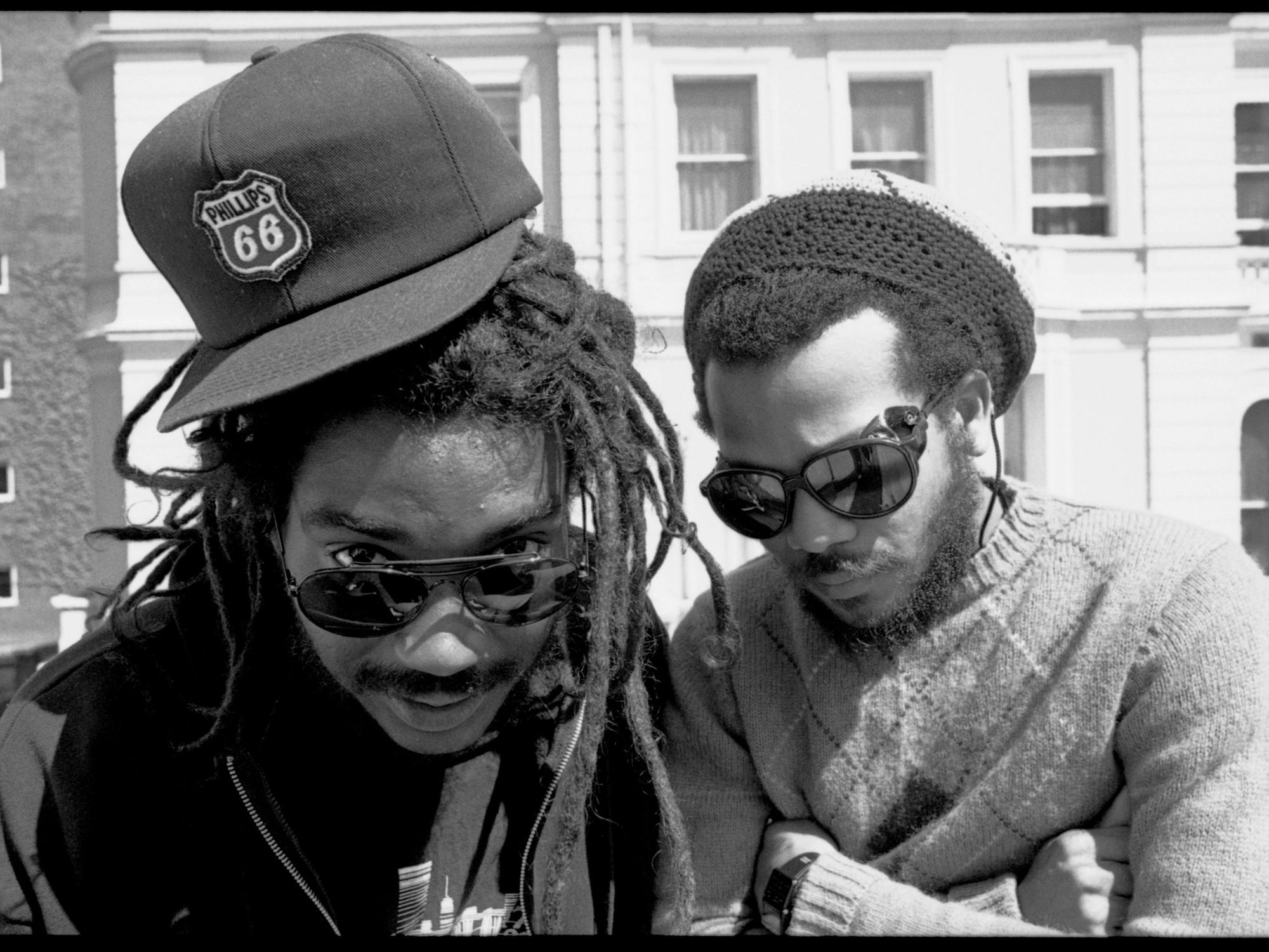Photo of pioneering black punk band Bad Brains with dreads and baseball cap in London in black and white.