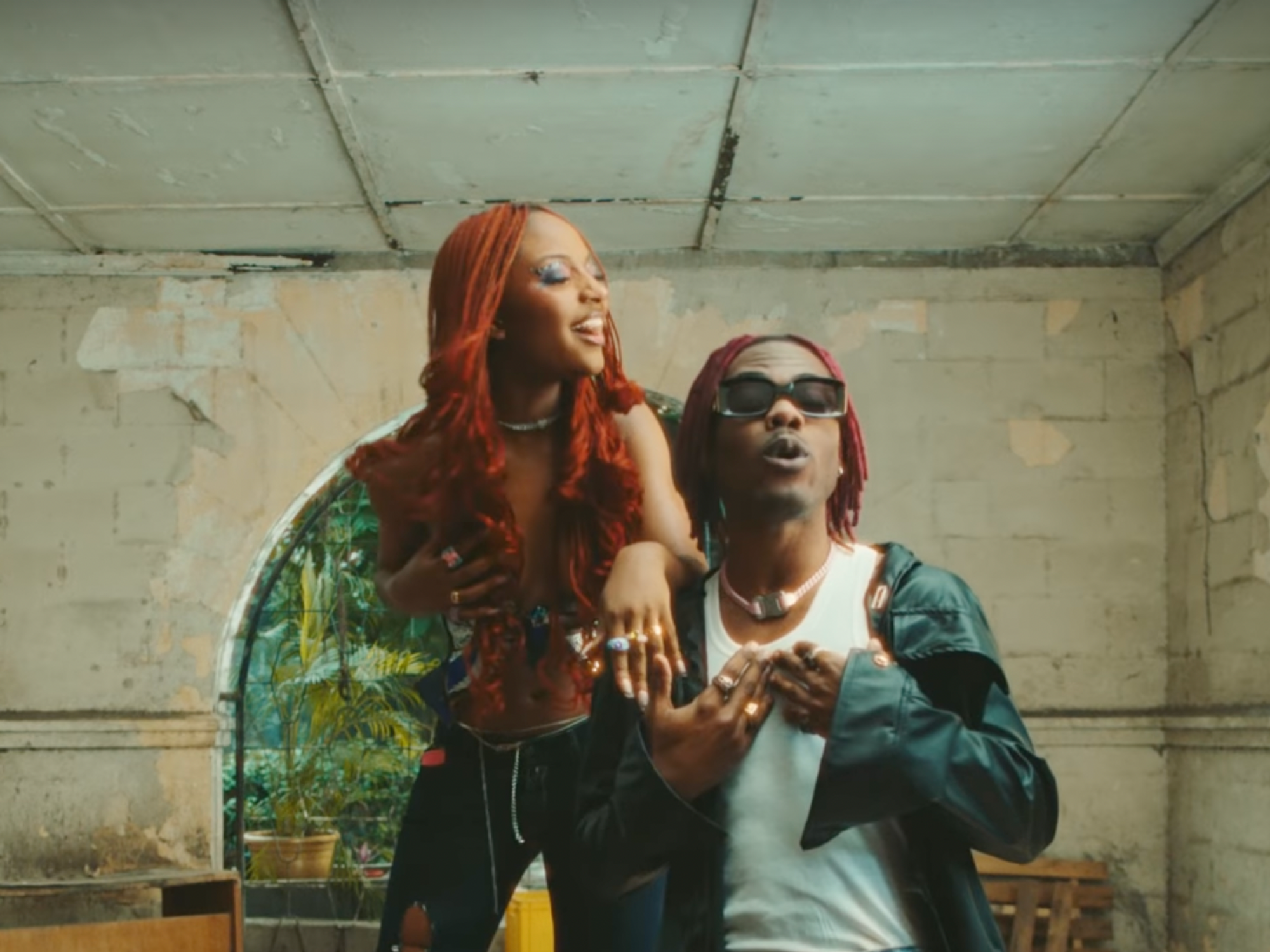 Pictured: Ayra Starr and CKay perform in her music video for track 'Beggie Beggie' 