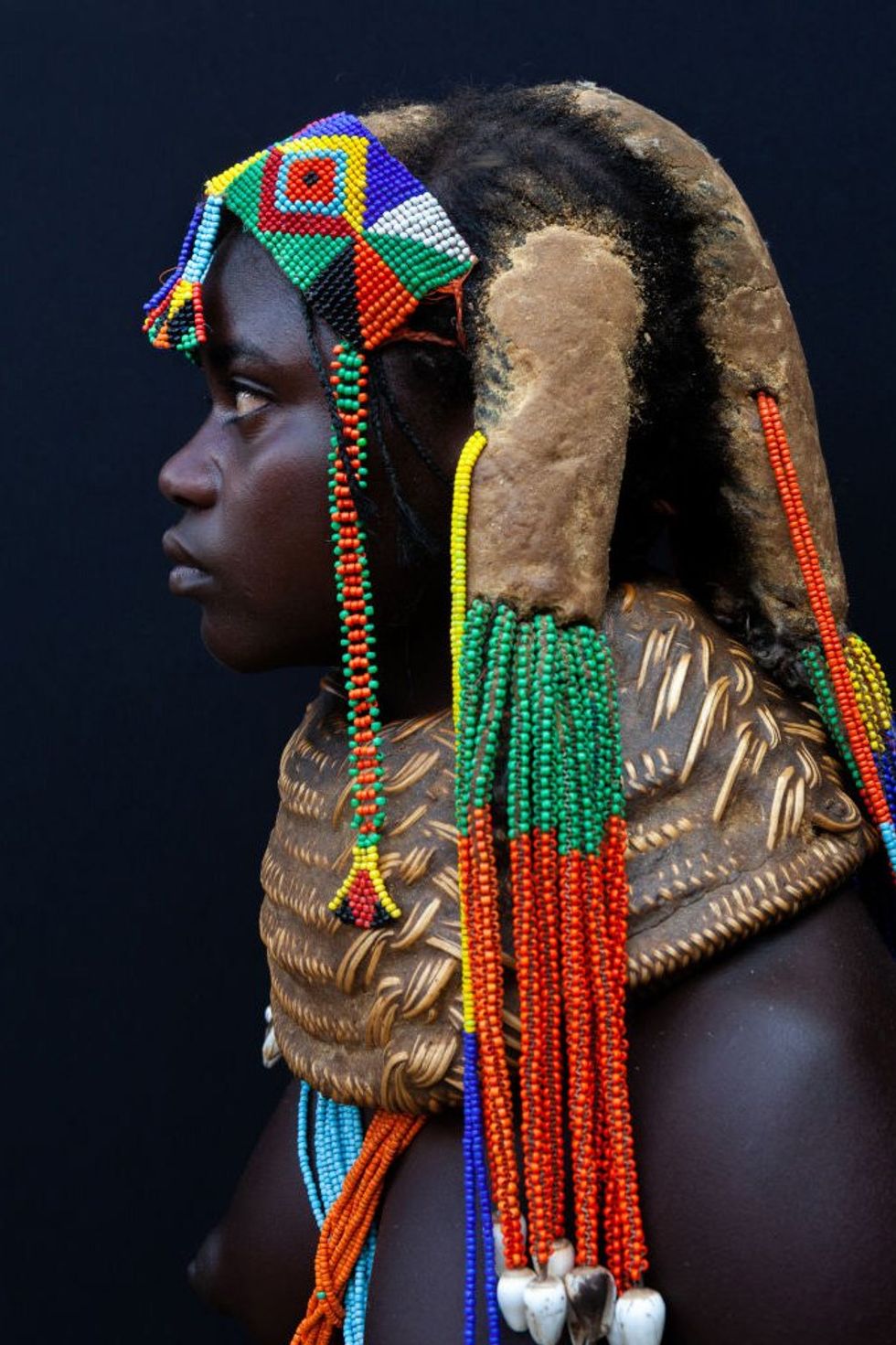 Portrait of a Mumuhuila teenage girl, Huila Province, Chibia, Angola on December 4, 2010 in Chibia, Angola.