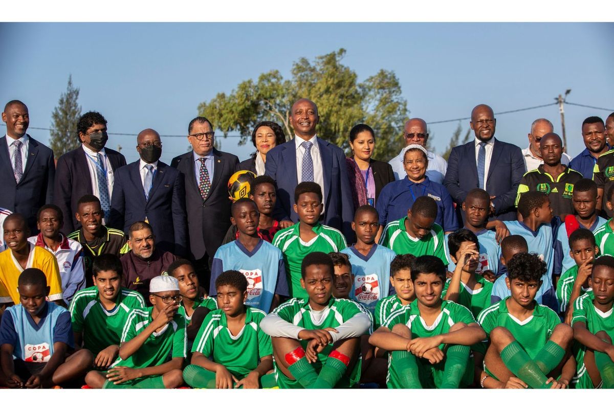 President of the Confederation of African Football (CAF) Patrice Motsepe poses for a photo with students and staff of the national school championship