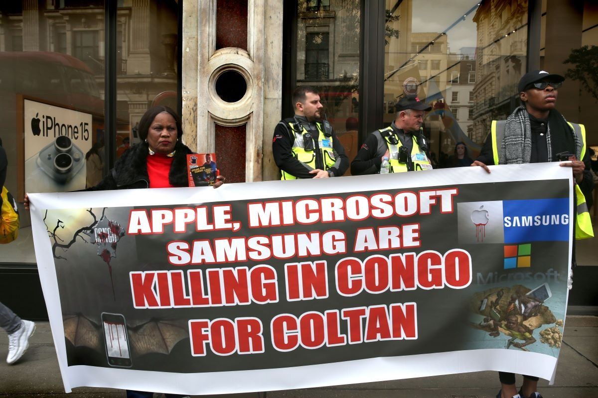 Protesters in London’s Regent Street hold a banner saying “Apple, Microsoft, Samsung Killing in Congo for Coltan” outside the Apple Store during the demonstration on April 6, 2024.