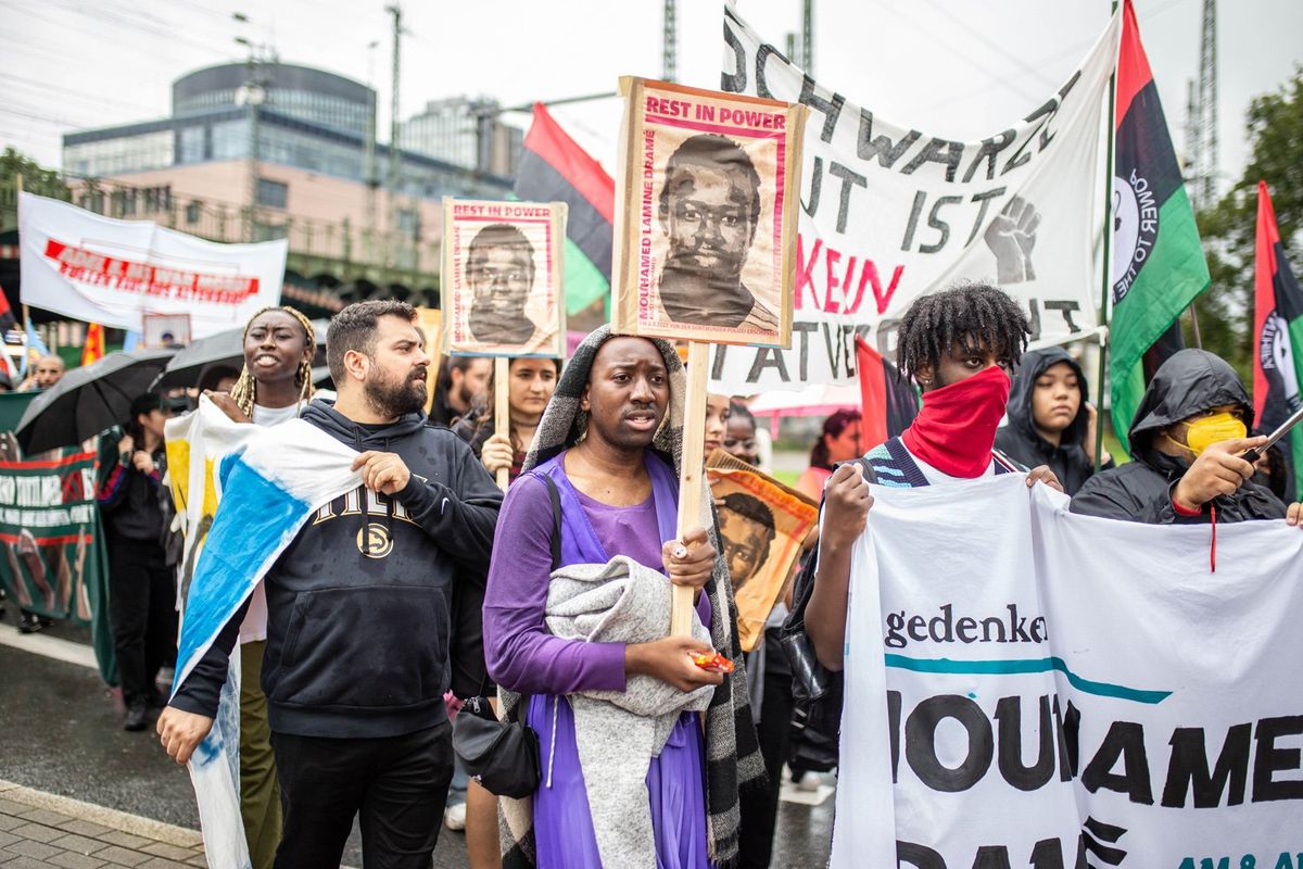 Protesters march through the streets to commemorate the killing of Mouhamed Dramé, a 16-year-old refugee from Senegal who was shot dead one year ago by Dortmund police on August 12, 2023 in Dortmund, Germany. The protesters chanted against police violence and demanded justice for police victims in the recent years in Germany. 