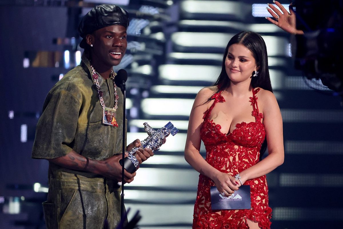 Rema and Selena Gomez accept the Best Afrobeats award for "Calm Down" onstage during the 2023 MTV Video Music Awards at Prudential Center on September 12, 2023 in Newark, New Jersey. 