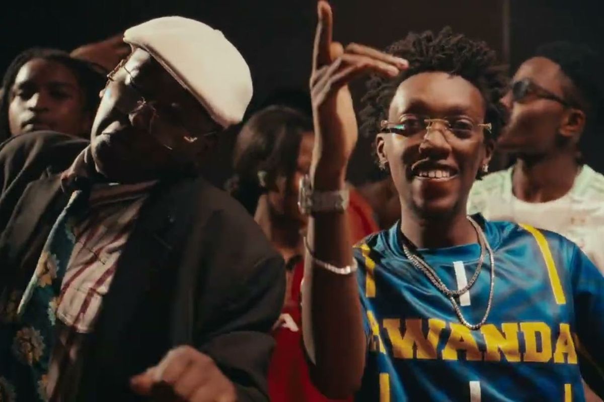 Rwandan artist Nel Ngabo smiling and dancing in a scene from the “HOZA” music video.