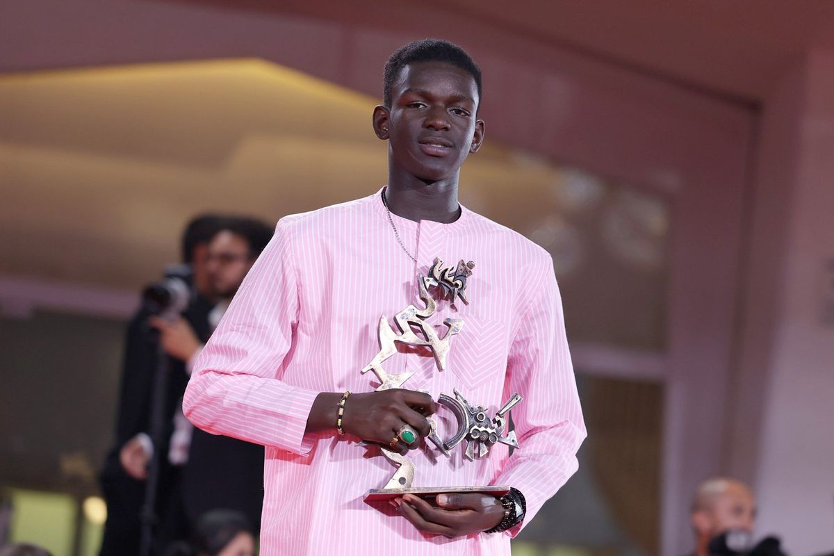 Seydou Sarr poses with the Marcello Mastroianni Award for Best New Young Actor or Actress for ‘Io Capitano’ at the winner's photocall at the 80th Venice International Film Festival on September 09, 2023 in Venice, Italy.
